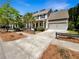 Charming two-story home with manicured landscaping, mature trees, and a two-car garage at 350 Oak Park St, Summerville, SC 29486