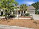 Charming two-story home with manicured landscaping, mature trees, and a two-car garage at 350 Oak Park St, Summerville, SC 29486