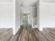 Entryway with hardwood floors leading to the living areas and stairs at 350 Oak Park St, Summerville, SC 29486