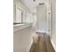 Hallway featuring wood floors and white trim leading to various rooms at 350 Oak Park St, Summerville, SC 29486