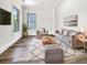 Bright living room featuring modern furniture, hardwood floors, and a large window with natural light at 350 Oak Park St, Summerville, SC 29486