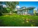 Spacious backyard features a well-manicured lawn and mature trees at 3769 Maidstone Dr, Mount Pleasant, SC 29466
