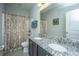 Modern bathroom with granite countertops, dual sinks, and a shower/tub combo at 3769 Maidstone Dr, Mount Pleasant, SC 29466
