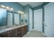 Stylish bathroom featuring double sinks, granite counters, and crisp white doors at 3769 Maidstone Dr, Mount Pleasant, SC 29466