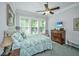 Comfortable bedroom featuring a ceiling fan, carpet flooring, and a large window at 3769 Maidstone Dr, Mount Pleasant, SC 29466