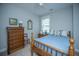 Charming bedroom with a bed, wood dresser, and a classic decor at 3769 Maidstone Dr, Mount Pleasant, SC 29466