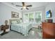 Cozy bedroom with a ceiling fan, carpet flooring, and bright natural light from the window at 3769 Maidstone Dr, Mount Pleasant, SC 29466