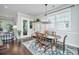 Bright dining room with dark wood floors, a chandelier, and a table with blue upholstered chairs at 3769 Maidstone Dr, Mount Pleasant, SC 29466