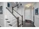 Elegant foyer with dark wood floors, a staircase with white railings, and a view of the front door at 3769 Maidstone Dr, Mount Pleasant, SC 29466