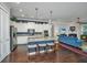 Open-concept kitchen with white cabinets, granite countertops, and a seamless flow to the living area at 3769 Maidstone Dr, Mount Pleasant, SC 29466