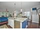 Bright, open kitchen island with stainless steel dishwasher, bar seating, and an adjacent dining area at 3769 Maidstone Dr, Mount Pleasant, SC 29466