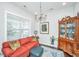 Cozy living room with red sofa, decorative pillows, a china cabinet and chandelier at 3769 Maidstone Dr, Mount Pleasant, SC 29466
