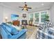 Comfortable living room featuring a fireplace, TV, ceiling fan, and blue upholstered seating at 3769 Maidstone Dr, Mount Pleasant, SC 29466