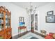 Elegant living room featuring a china cabinet, chandelier, and a doorway view of the home's foyer at 3769 Maidstone Dr, Mount Pleasant, SC 29466