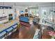 Open-concept living room with granite counters, fireplace, hardwood floors, and abundant natural light at 3769 Maidstone Dr, Mount Pleasant, SC 29466