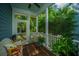 Inviting screened porch featuring wicker furniture and a view of the backyard at 3769 Maidstone Dr, Mount Pleasant, SC 29466