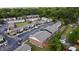 Aerial view of brick apartment buildings featuring ample parking and mature landscaping at 415 Parkdale Dr # 2F, Charleston, SC 29414