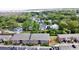 Aerial view of a brick apartment complex with lush green trees, with marshland in the distance at 415 Parkdale Dr # 2F, Charleston, SC 29414