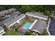 An aerial view of a large pool, sun loungers, and palm trees at this apartment community, perfect for relaxation at 415 Parkdale Dr # 2F, Charleston, SC 29414