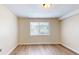 Well-lit bedroom showcasing hardwood floors, fresh paint, and a window for natural light at 415 Parkdale Dr # 2F, Charleston, SC 29414