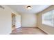 Cozy bedroom with hardwood floors, neutral walls, and a view into the bathroom at 415 Parkdale Dr # 2F, Charleston, SC 29414