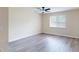 Inviting bedroom featuring hardwood floors, a window and natural light, and neutral paint at 415 Parkdale Dr # 2F, Charleston, SC 29414