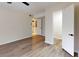 Modern bedroom featuring wood-look floors and an open doorway to a walk-in closet with a ceiling fan at 415 Parkdale Dr # 2F, Charleston, SC 29414