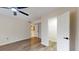 Bedroom showing hardwood floors, a ceiling fan, closet and laundry access at 415 Parkdale Dr # 2F, Charleston, SC 29414