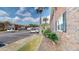 Exterior view of a brick apartment building with ample parking spaces and partial tree coverage at 415 Parkdale Dr # 2F, Charleston, SC 29414