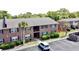 Well-maintained brick apartment building featuring mature landscaping and ample parking at 415 Parkdale Dr # 2F, Charleston, SC 29414