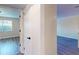 Hallway with door leading to bedroom. The door is white. The floors are gray at 415 Parkdale Dr # 2F, Charleston, SC 29414