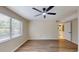 Bright living room featuring hardwood floors, a ceiling fan, and a large window with natural light at 415 Parkdale Dr # 2F, Charleston, SC 29414
