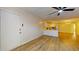 This open-concept living room features wood-look flooring, fresh paint, and an open kitchen at 415 Parkdale Dr # 2F, Charleston, SC 29414