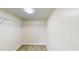 Spacious walk-in closet featuring wood-look flooring and adjustable shelving for optimal storage and organization at 415 Parkdale Dr # 2F, Charleston, SC 29414