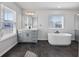 Bright bathroom with a soaking tub, modern vanity, and stylish tile flooring at 424 Carrara Dr, Summerville, SC 29486