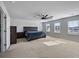 Spacious bedroom featuring a large bed, ample natural light, and a ceiling fan at 424 Carrara Dr, Summerville, SC 29486