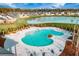 Stunning aerial view of a neighborhood pool overlooking the lake at 424 Carrara Dr, Summerville, SC 29486