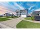 Beautiful exterior with a lush lawn and a convenient two-car driveway and mailbox at 424 Carrara Dr, Summerville, SC 29486