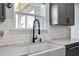Kitchen sink with a black faucet, white countertop, and window at 424 Carrara Dr, Summerville, SC 29486