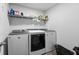 Laundry room featuring modern appliances, storage shelf, and a basket at 424 Carrara Dr, Summerville, SC 29486