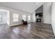 Bright living room with hardwood floors and a fireplace with a mounted TV at 424 Carrara Dr, Summerville, SC 29486