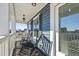 Inviting porch with rocking chairs, offering a relaxing outdoor space with neighborhood views at 424 Carrara Dr, Summerville, SC 29486