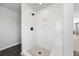Modern shower with white subway tile, bench seating, and a mosaic tile floor at 424 Carrara Dr, Summerville, SC 29486