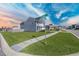 Corner lot featuring verdant lawn, a sidewalk, and clear street-name signage at 424 Carrara Dr, Summerville, SC 29486