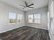 Bright sunroom with hardwood floors, neutral walls, and several windows at 424 Carrara Dr, Summerville, SC 29486