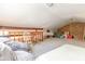 Spacious carpeted attic featuring a unique brick accent wall at 4407 S Shirley Dr, North Charleston, SC 29418