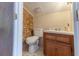 Cozy bathroom with a classic vanity and brick accent wall at 4407 S Shirley Dr, North Charleston, SC 29418