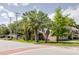 A home sits behind large palms and a brick-lined road, exuding charm at 4407 S Shirley Dr, North Charleston, SC 29418