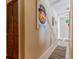 Well-lit hallway featuring unique artwork adds character and visual interest to the home at 4407 S Shirley Dr, North Charleston, SC 29418
