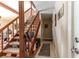 Hallway with staircase, neutral walls, and tiled floors, creating a bright space at 4407 S Shirley Dr, North Charleston, SC 29418
